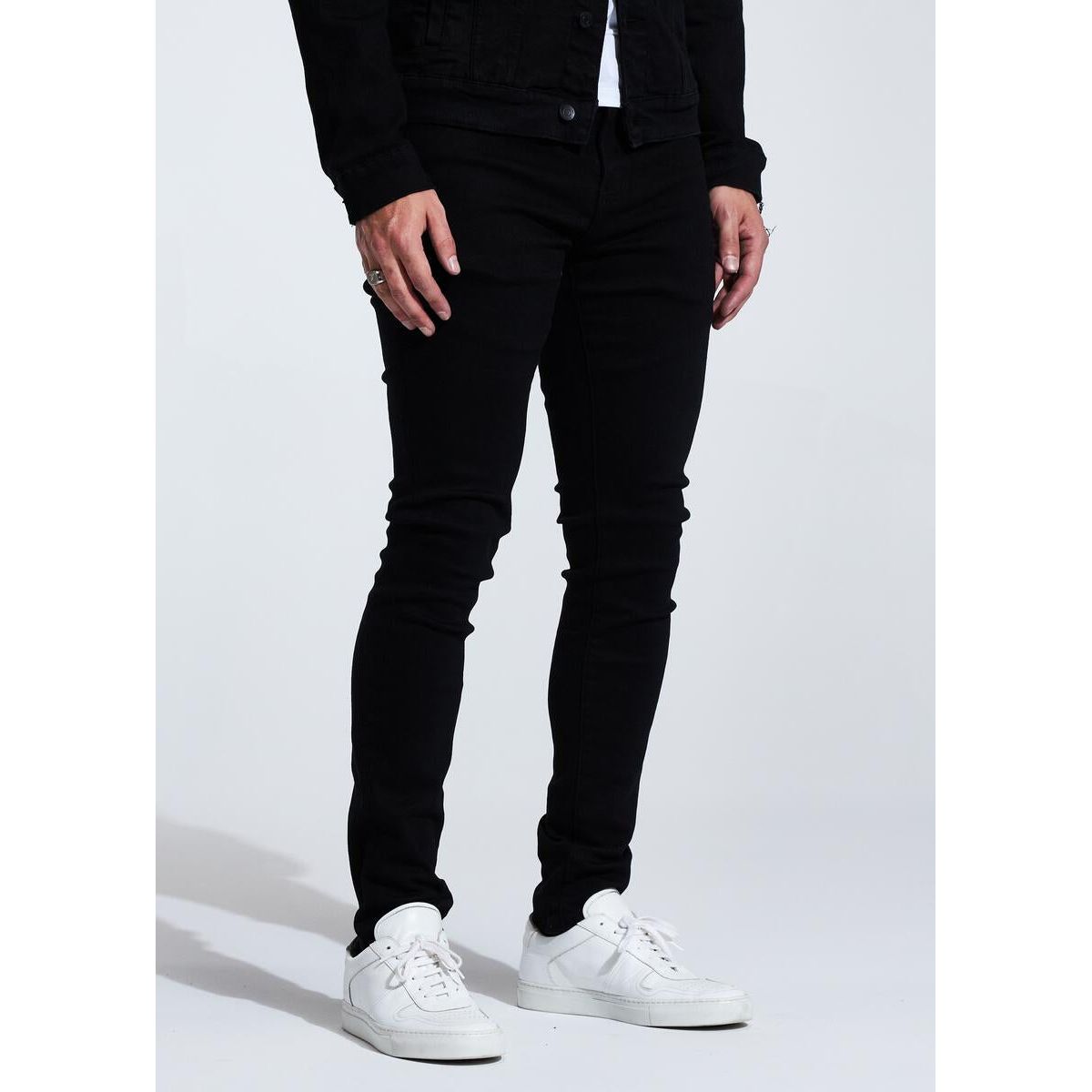 Embellish Spencer (No Distress) Jet Black Jeans front view with logo patch