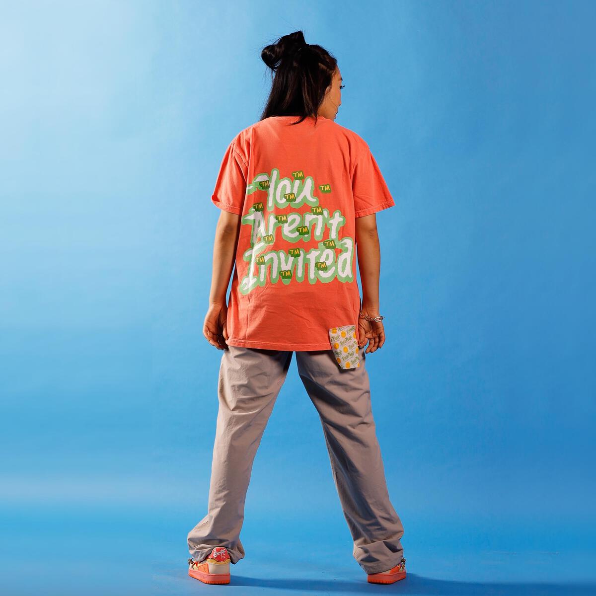 Detailed view of the Spiked Lime Dripsicle Tee's high-quality fabric and stitching