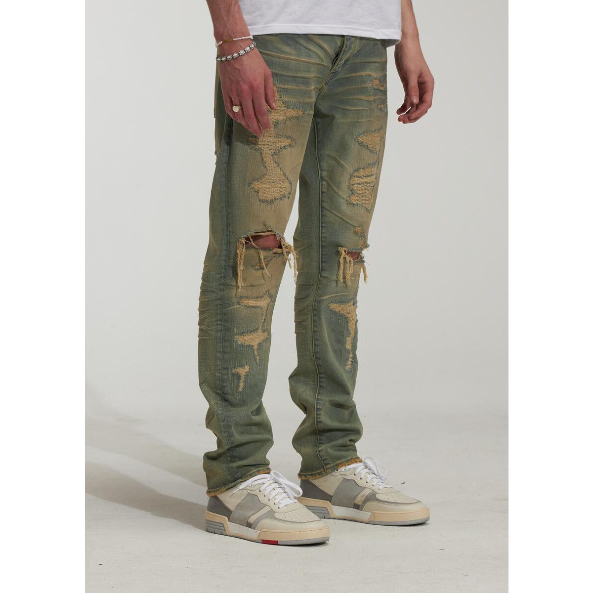 Side view of Embellish Criss Ripped Indigo Denim Jeans showcasing the ripped and distressed design