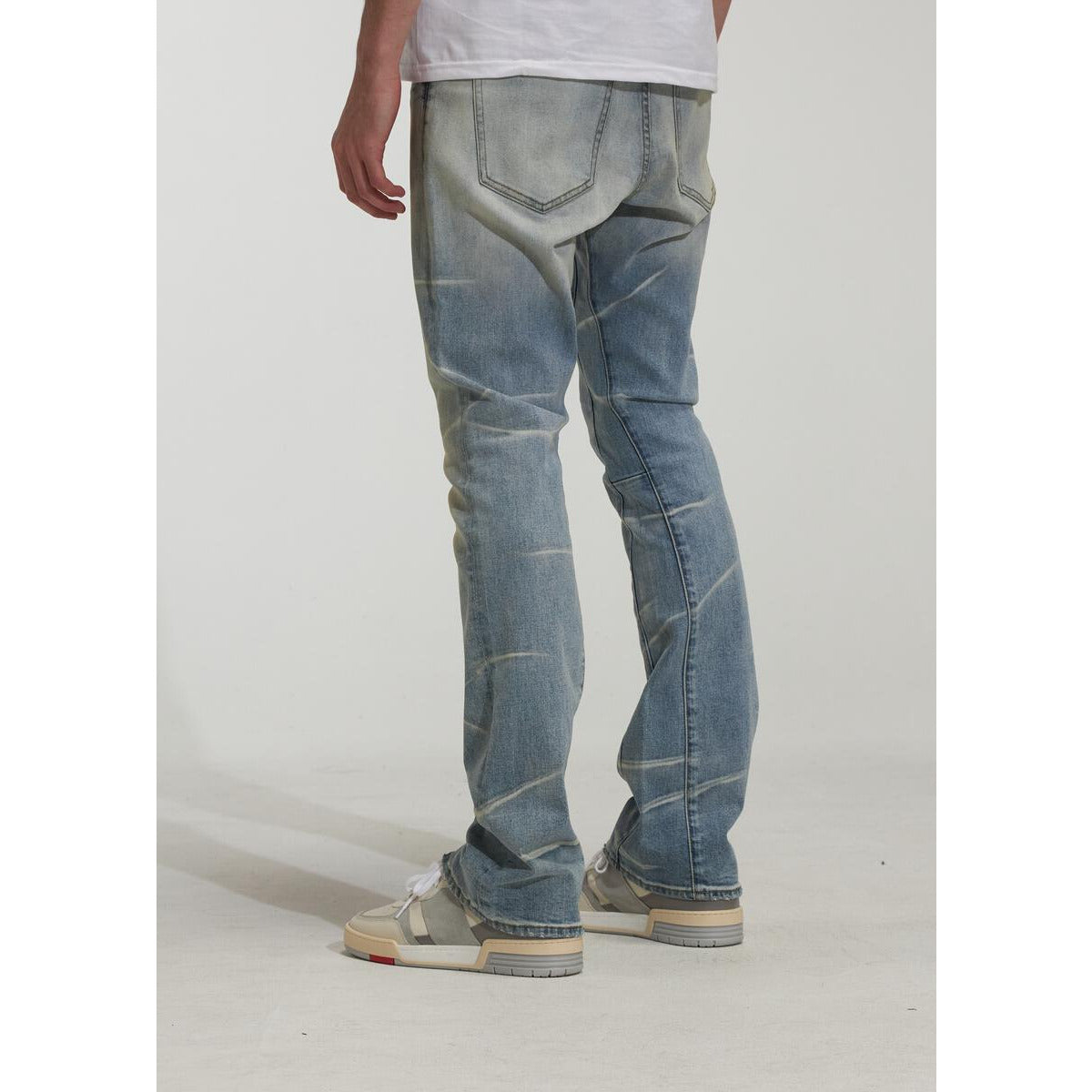 Embroidered RIC Tides Denim Jeans in light blue wash with distressing and frayed hems