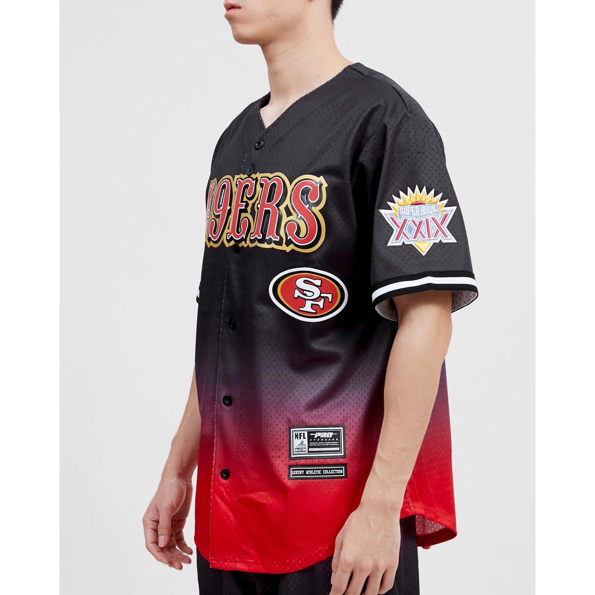 Officially licensed Pro Standard San Francisco 49ers team jersey in black and red ombre mesh pattern on display
