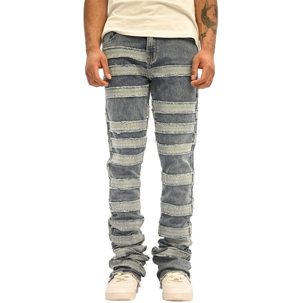Close-up of Indigo Wash Doctrine Kill Joy Stacked Jeans, showing intricate stitching and unique pocket design