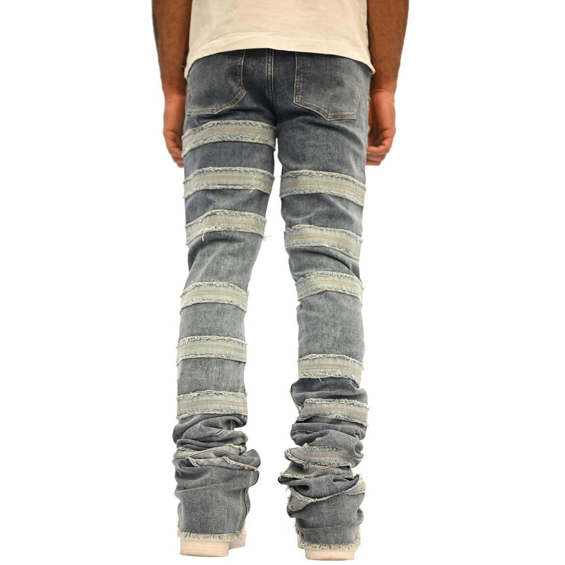 Close-up of Doctrine Kill Joy Stacked Jeans in Indigo Wash, featuring distressed detailing and a relaxed fit for modern, casual style