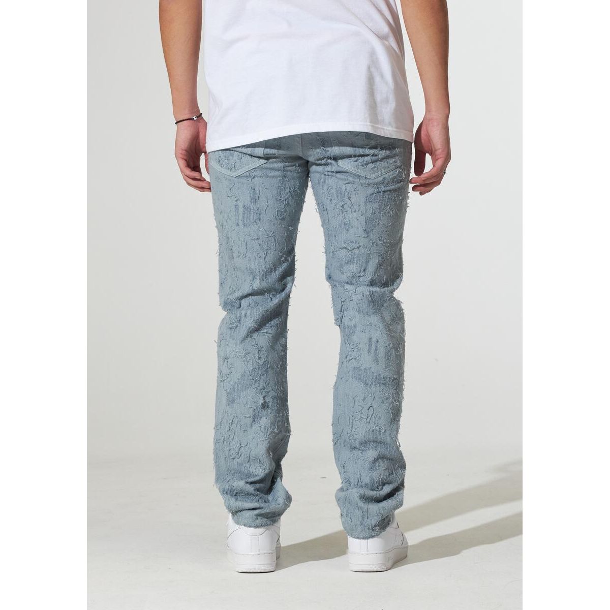 Detail shot of CRYSPF123-08 Arctic Blue distressed jeans with whiskering