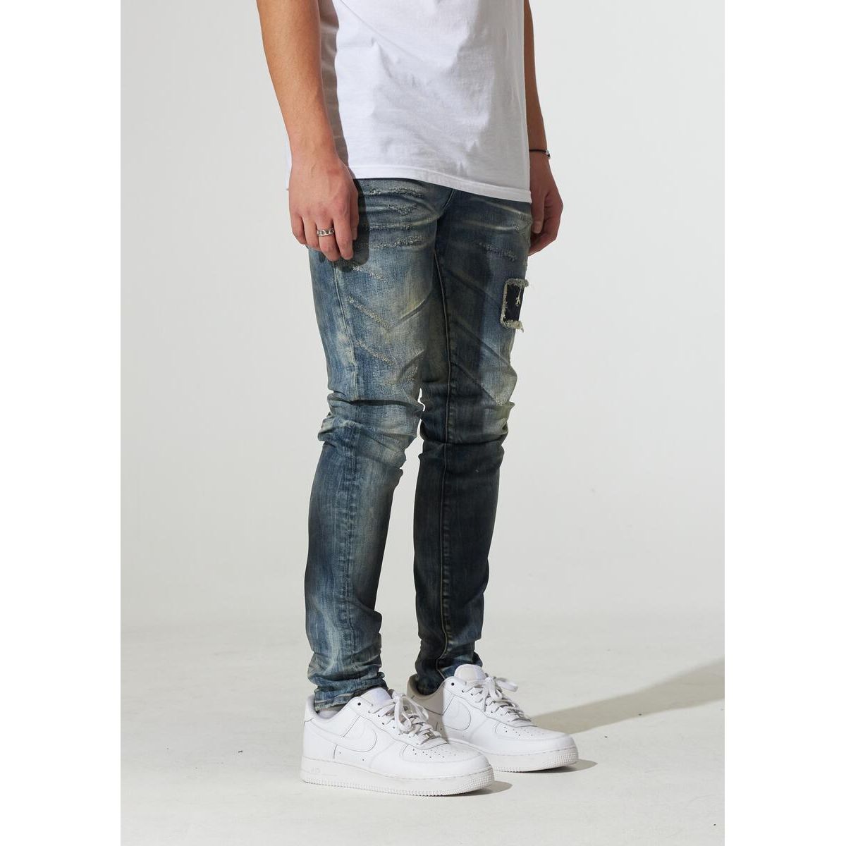Model wearing Crysp Denim Atlantic Dirty Indigo Jeans, side view
