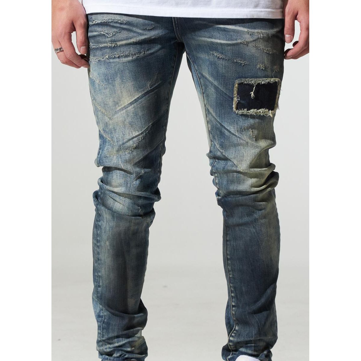 Close-up of the distressed details on Crysp Denim Atlantic Dirty Indigo Jeans