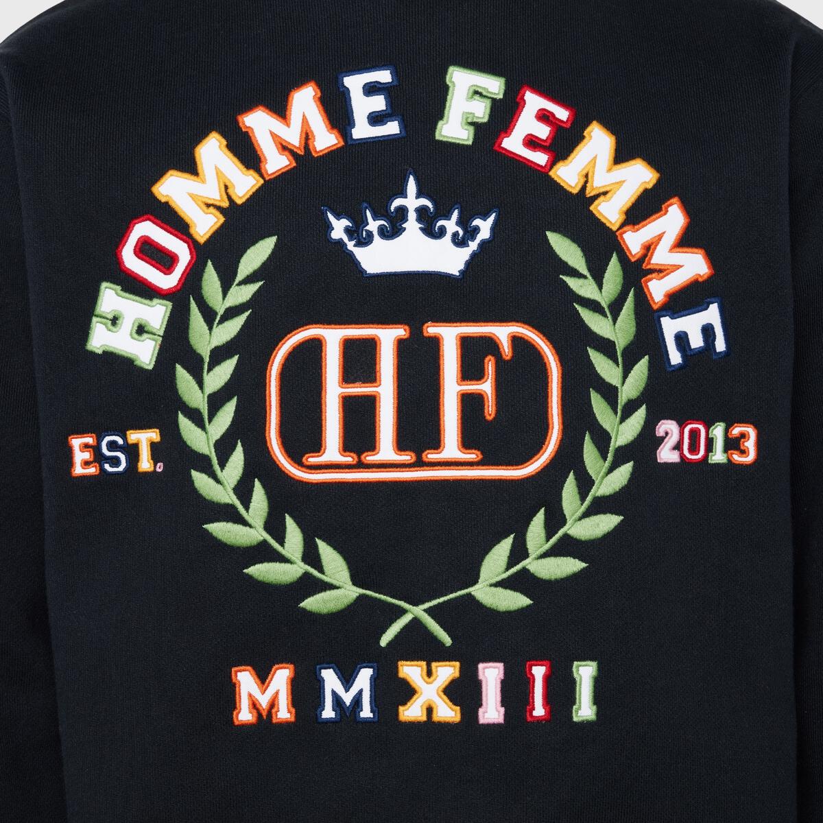 Black crewneck sweatshirt with embroidered 10 year crest for Homme + Femme
