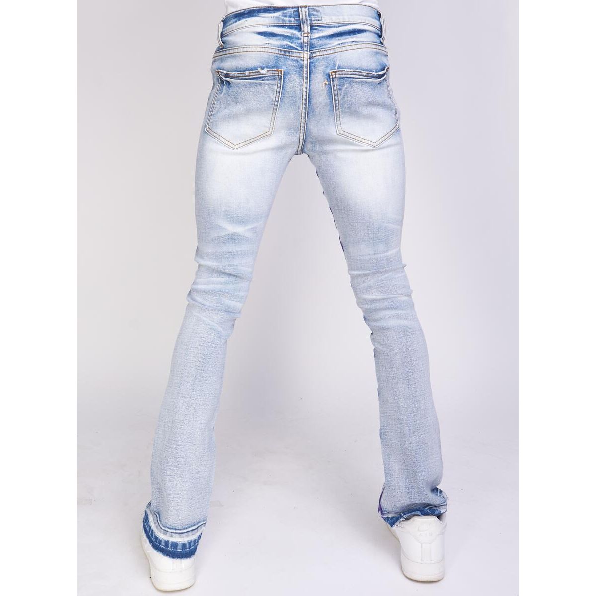 Close up of the back pocket of PLTKS Blue Purple Stacked Embroidery Denim (Barkley502) with detailed stitching and vibrant colors