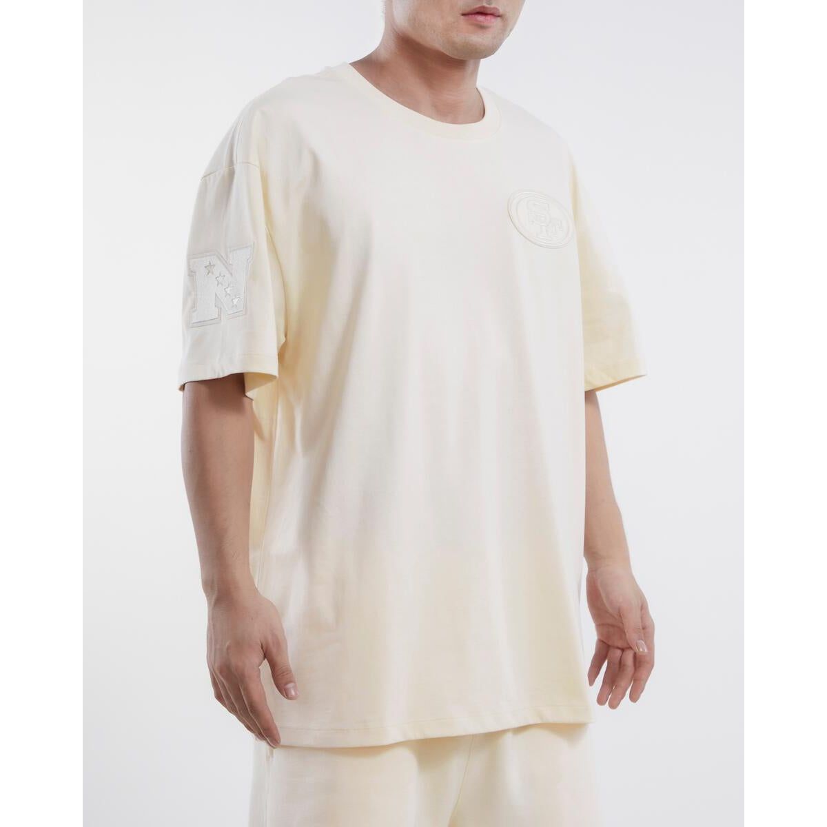 Pro Standard San Francisco 49ers Neutral Drop Shoulder Tee in Eggshell color, perfect for showcasing team pride on game day or any casual occasion
