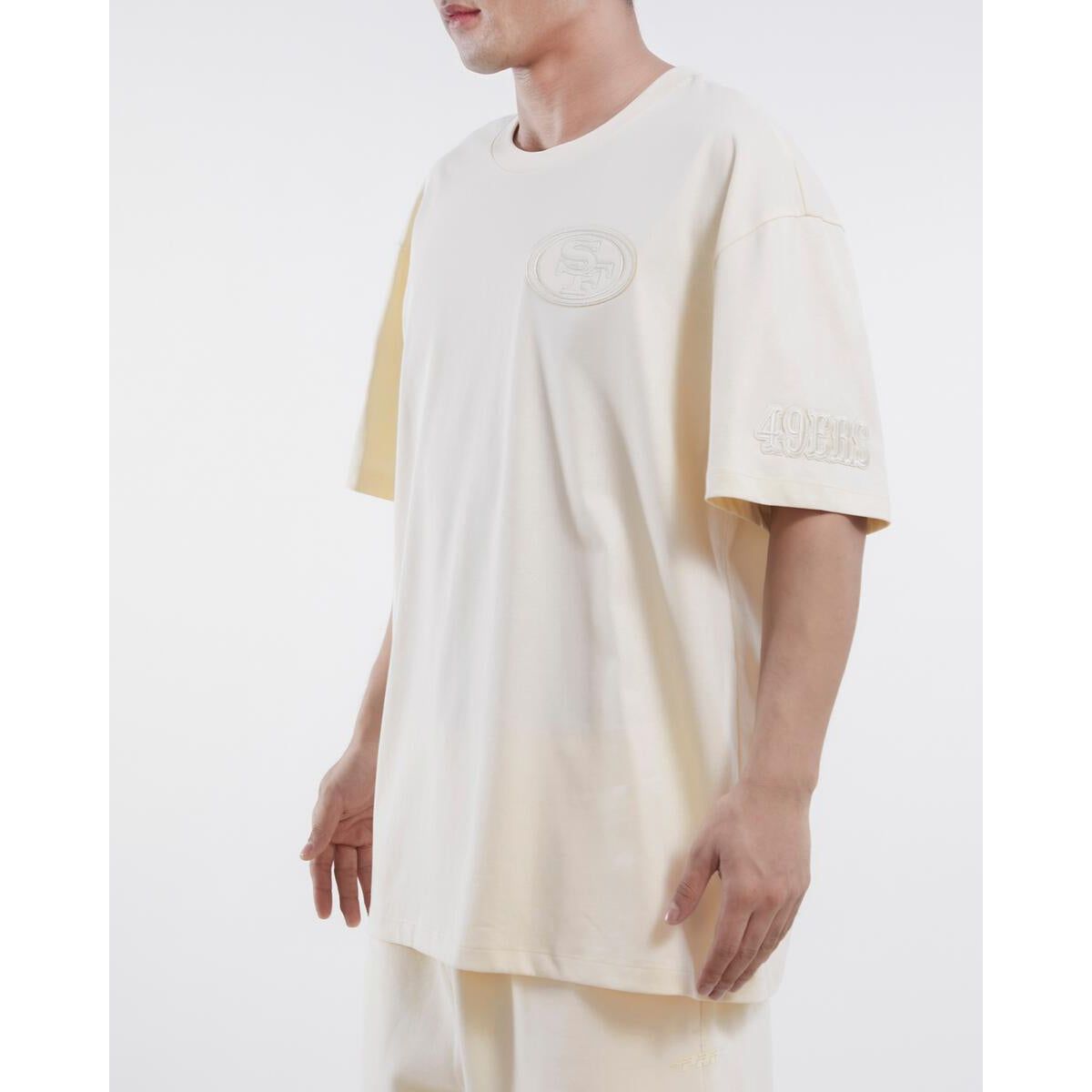 Pro Standard San Francisco 49ers neutral drop shoulder tee in eggshell color, featuring the official team logo and made with high-quality materials