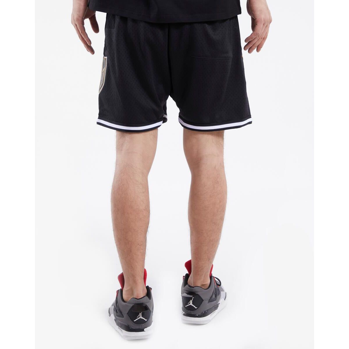 Black mesh shorts with the Vegas Golden Knights logo and detailing
