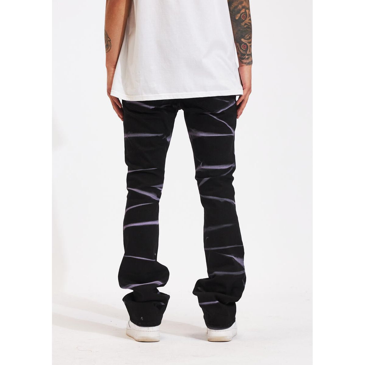 Crysp Denim Arch Black Flare Denim Jeans paired with white sneakers and crop top