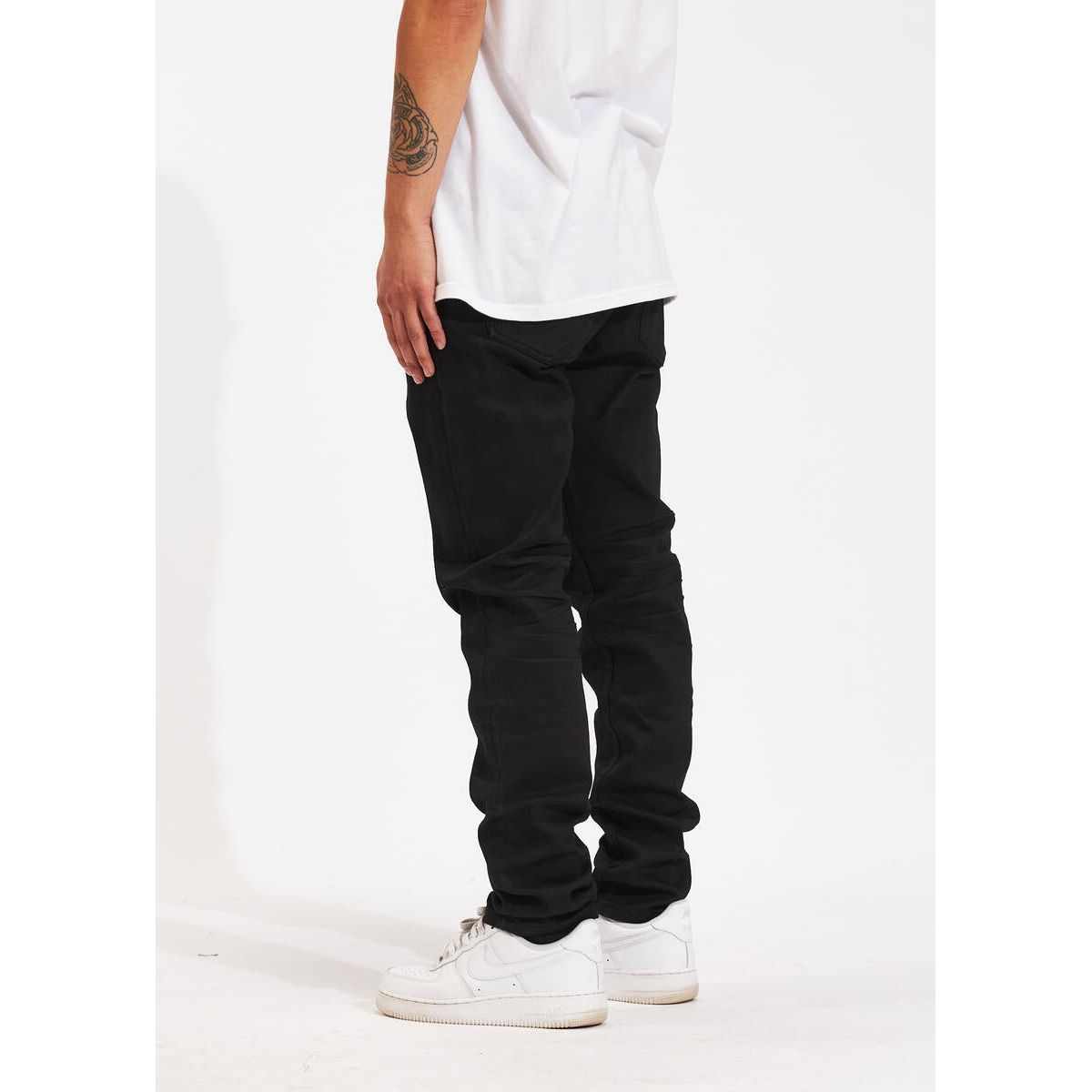 Model wearing Crysp Denim Atlantic Regular Black Denim Jeans, side view, urban style
