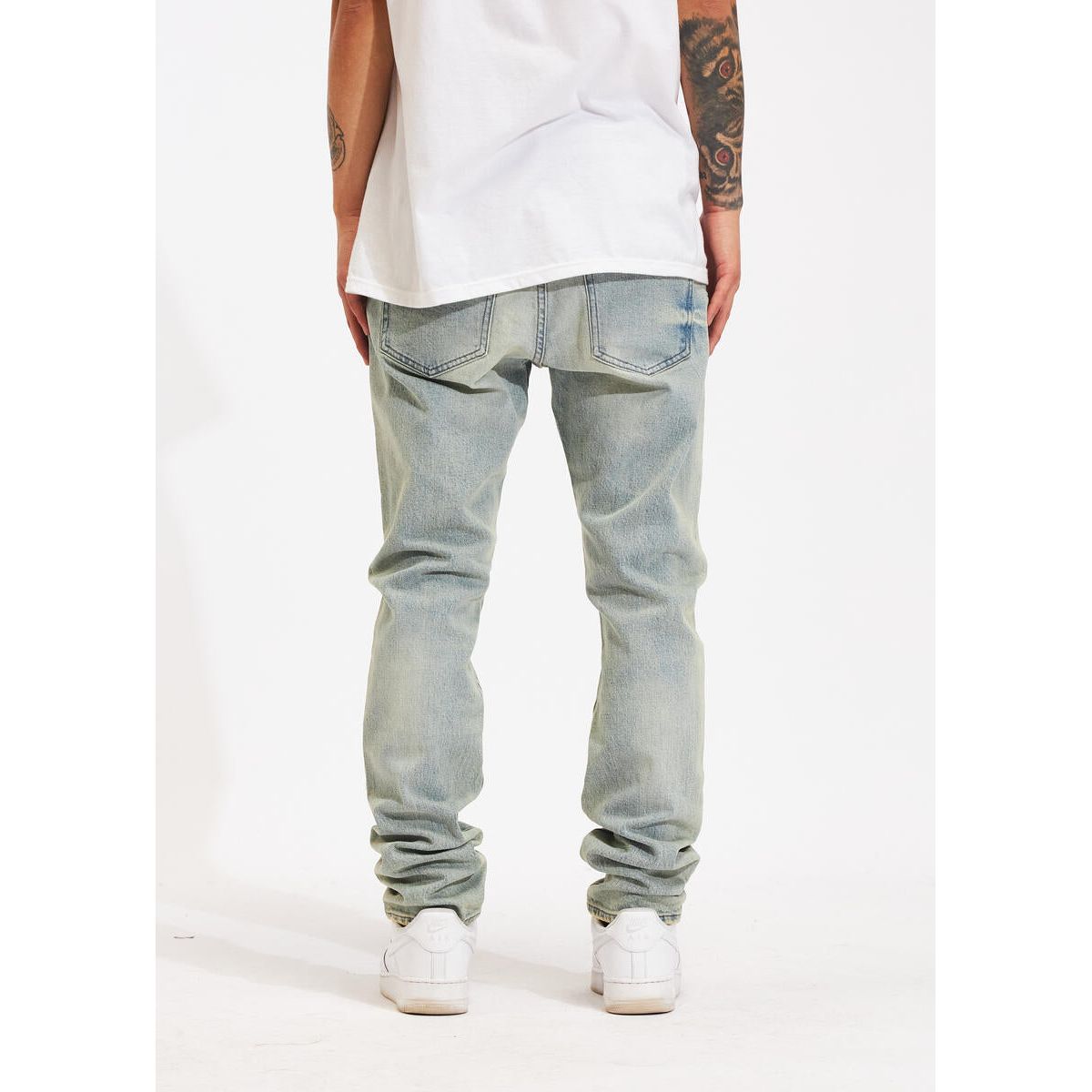 Side view of Crysp Denim Atlantic Light Wash Denim Jeans (CRYSPHOL23-20) showcasing the light wash and slim fit design