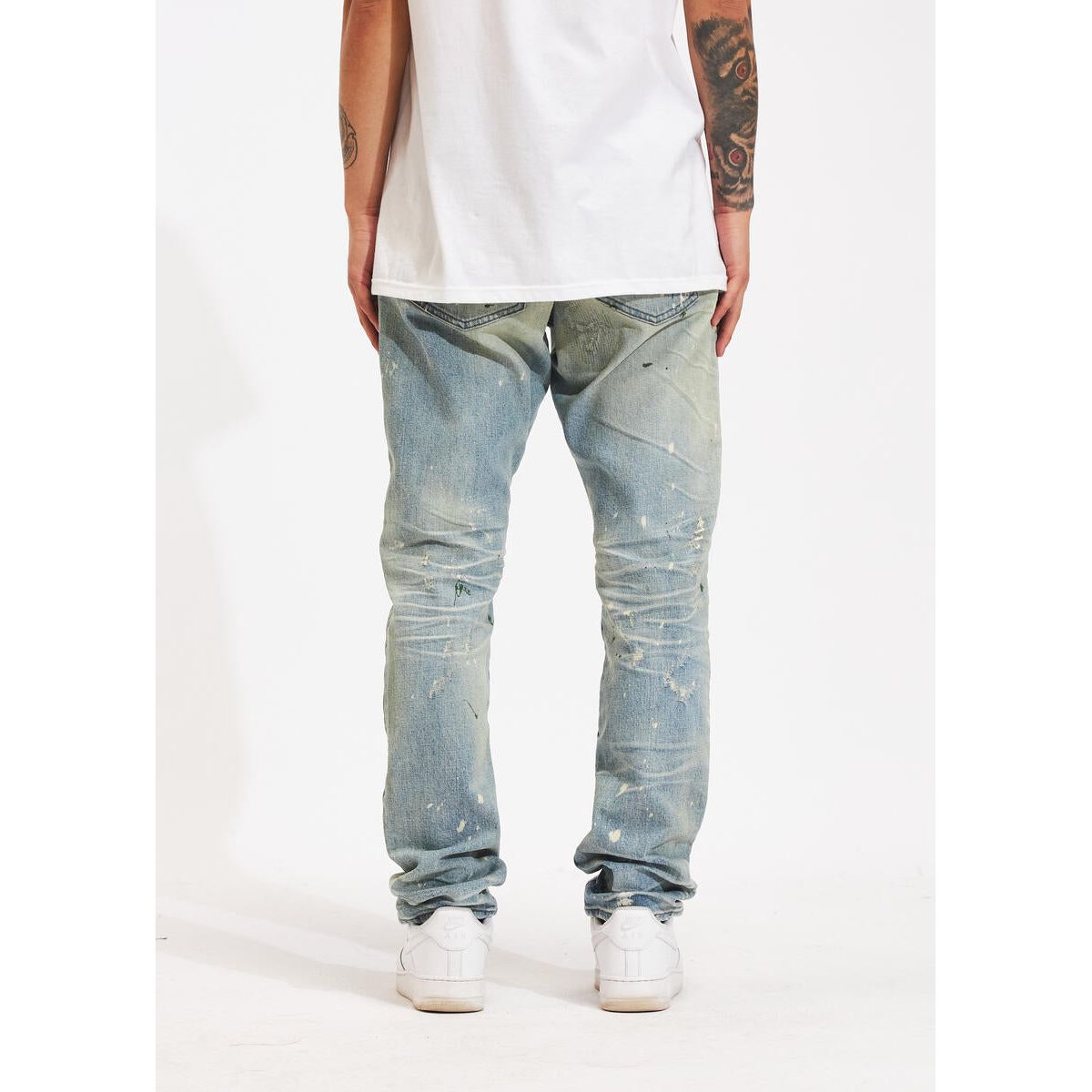 Back view of Crysp Denim Atlantic Stone Wash Paint Denim Jeans showing off the signature leather patch and logo embroidery