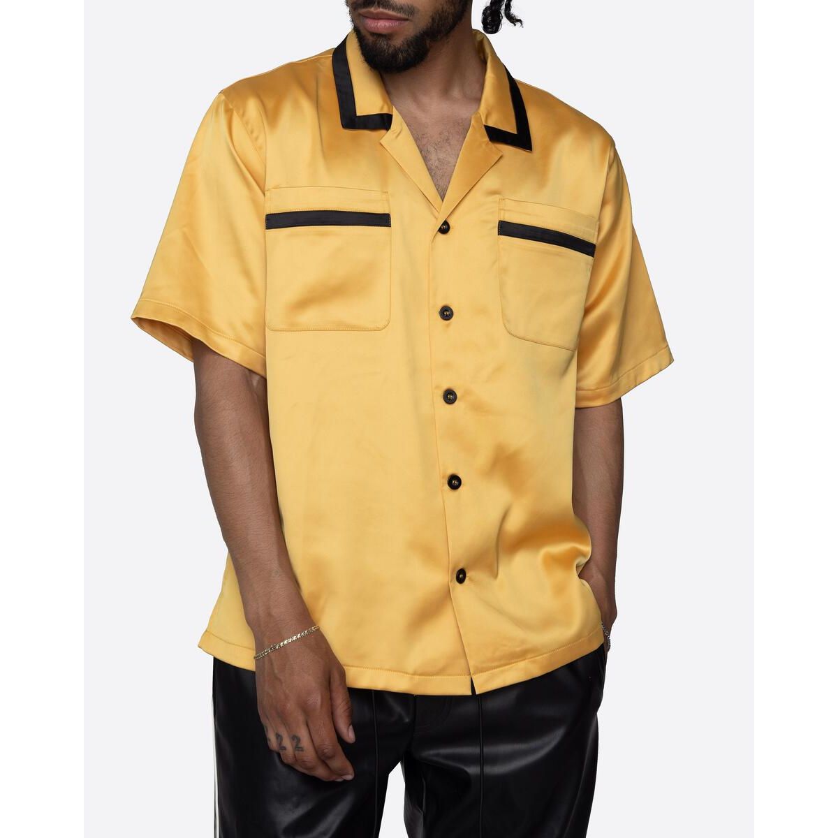 Close-up of the yellow EPTM Villa Button Shirt, showcasing its fine details and quality craftsmanship