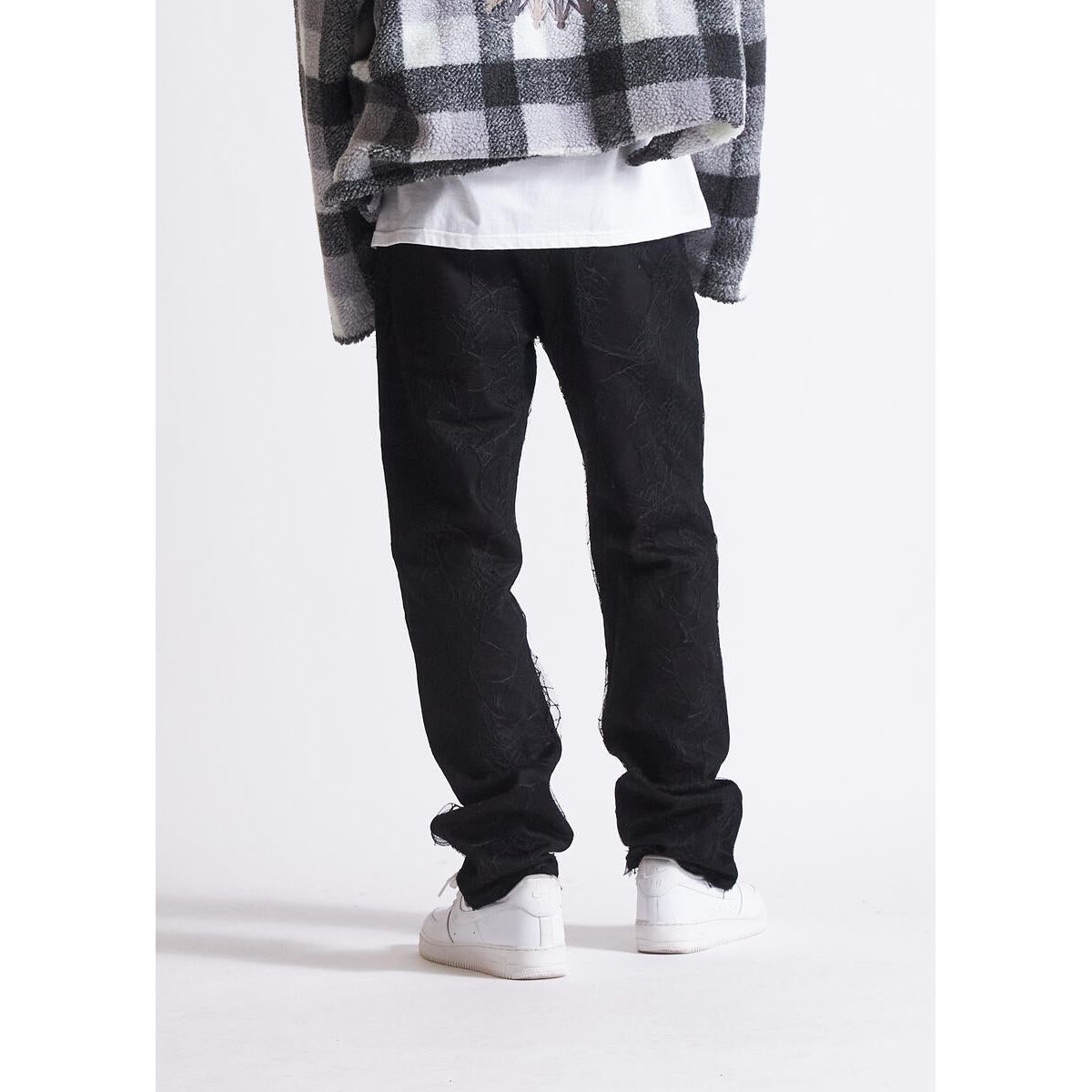 EMBHOL23-040 black jeans with stylish rips and tears for a bold look