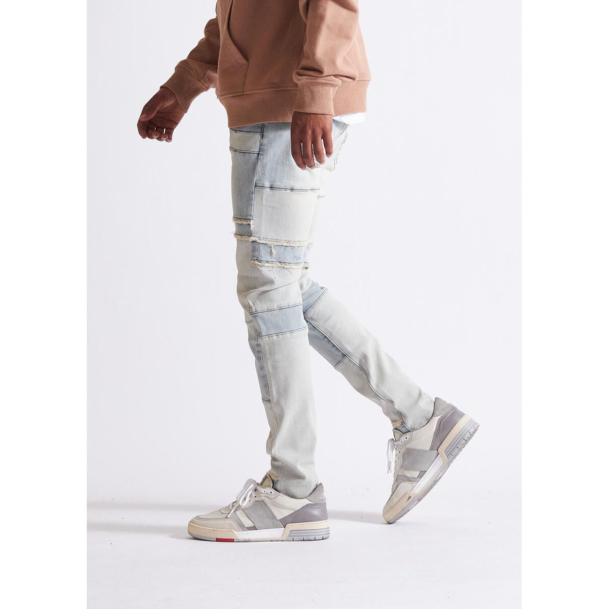 Embellish Sector Light Blue Denim Jeans with a unique bleached effect and ripped accents