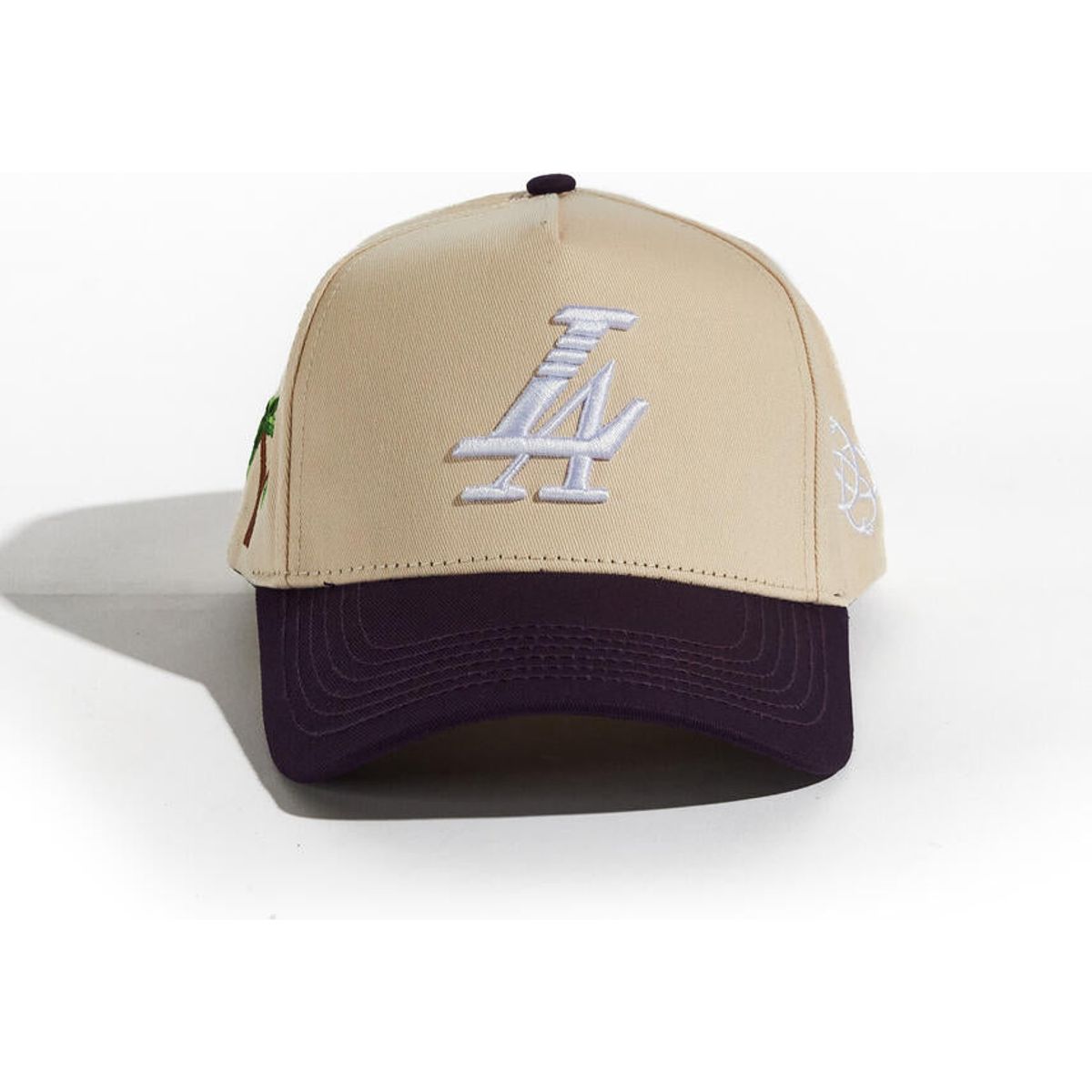 Stylish cream and purple Reference Paradise LA Snapback Hat worn by a model