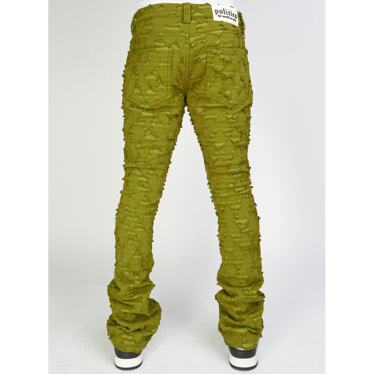 Front view of PLTKS Olive Shredded Stacked Flare jeans in Lucas502 on display