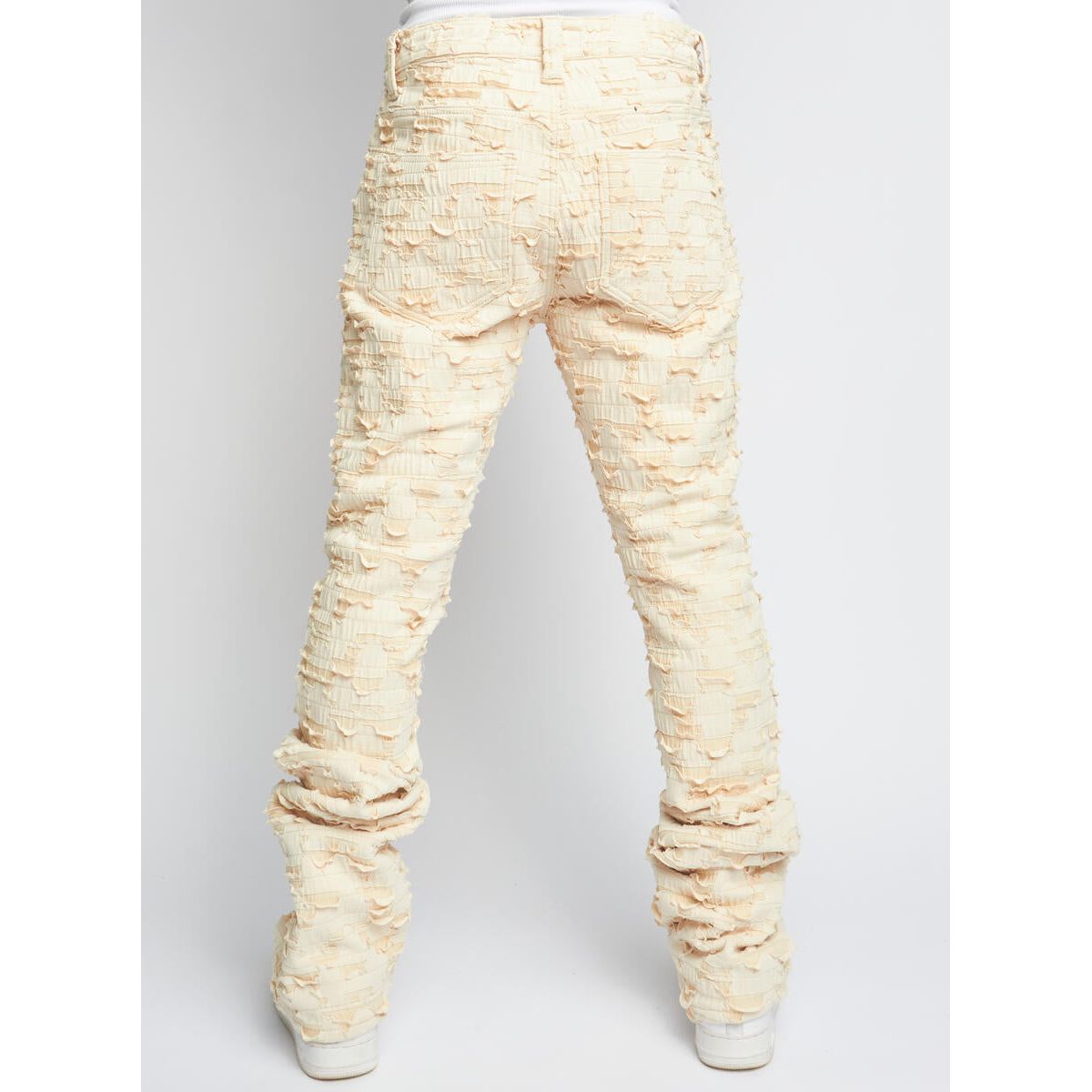 Close-up shot of PLTKS Cream Shredded Stacked Flare (Lucas501) denim fabric texture and stitching