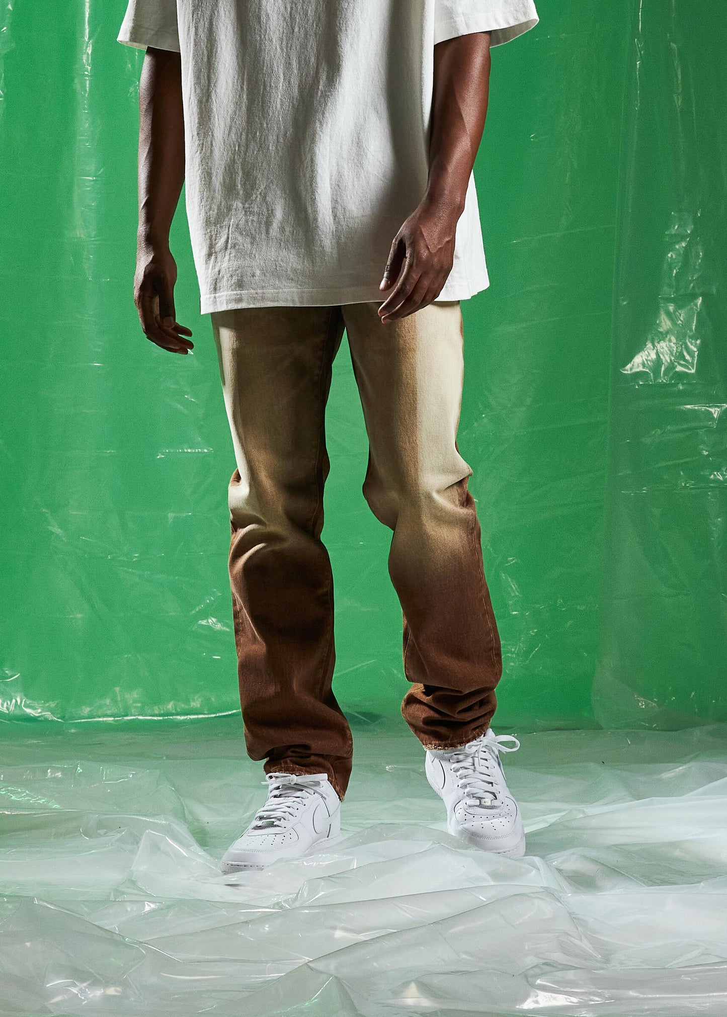 Embellish Saddle Tabacco Wash Denim Jeans featuring a slim fit and tobacco wash with distressed accents