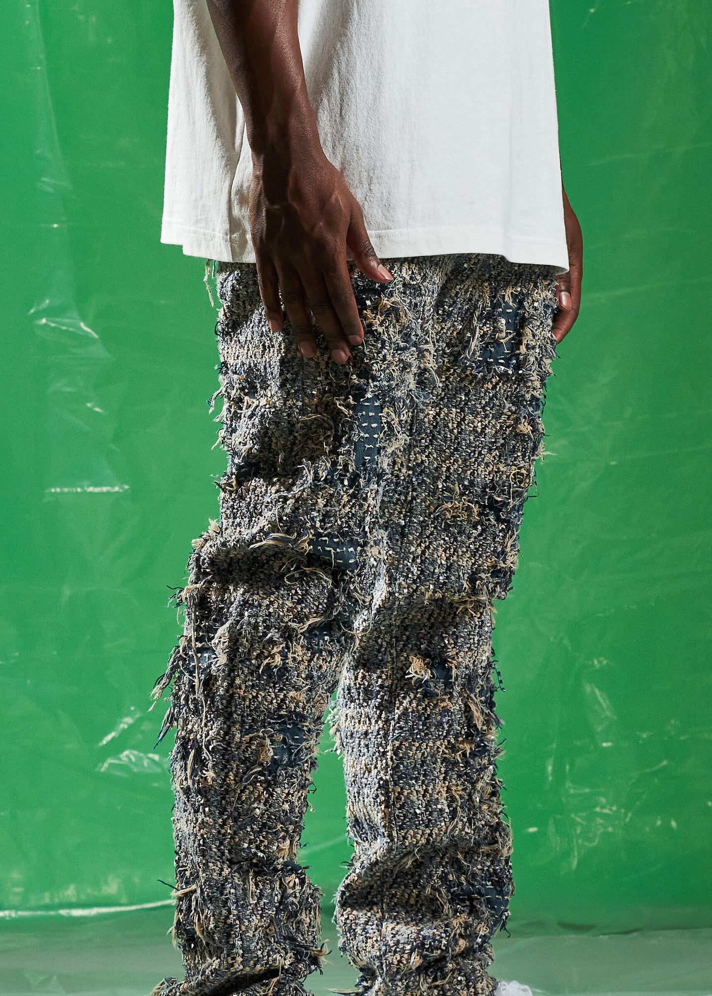 Close-up of Embellish Blue Salvage Denim Jeans featuring distressed detailing and contrast stitching