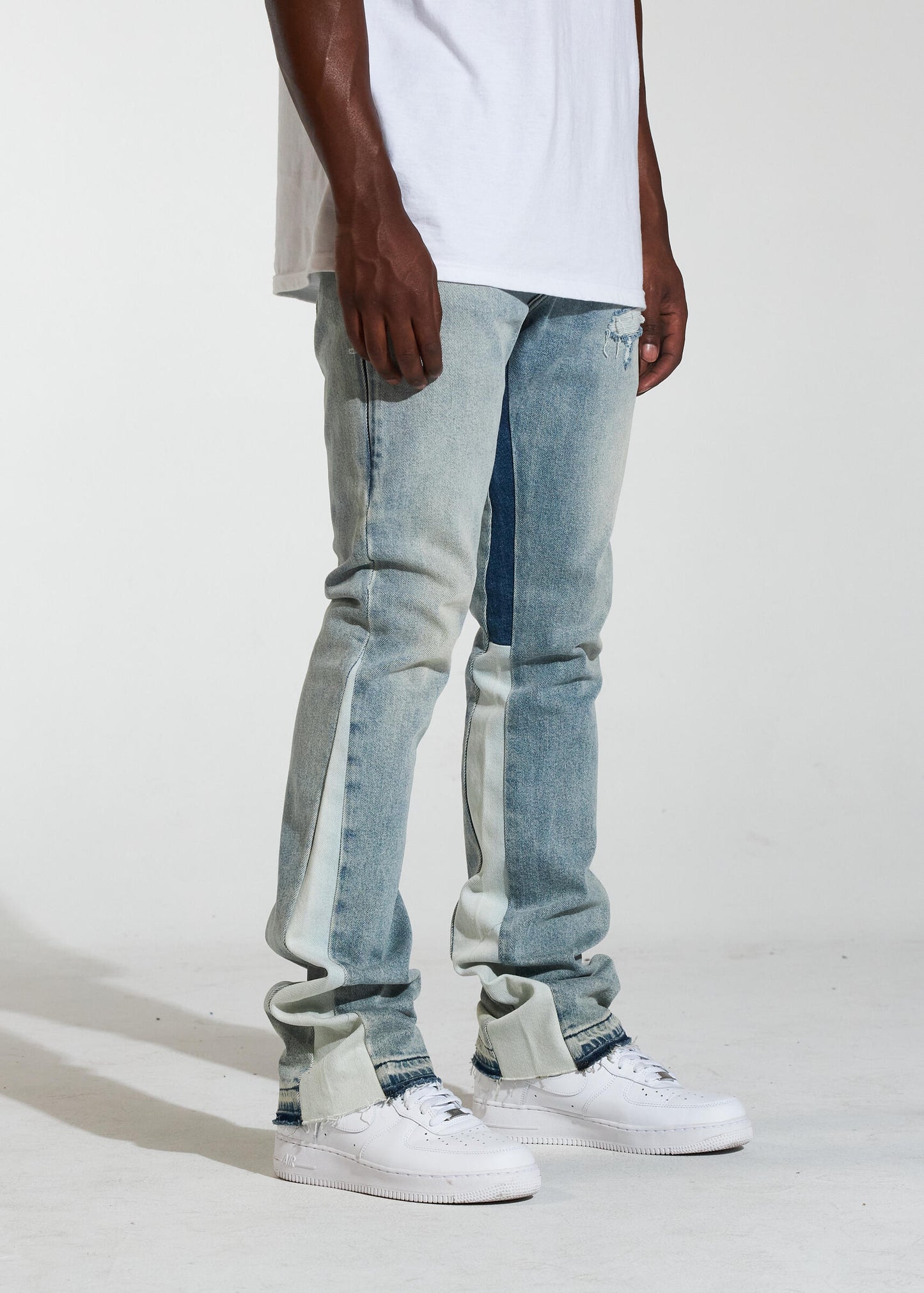 Crysp Denim Arch Light Wash Stacked Denim Jeans (CRYSPR241-022) laying flat, showcasing the light blue wash and slim fit