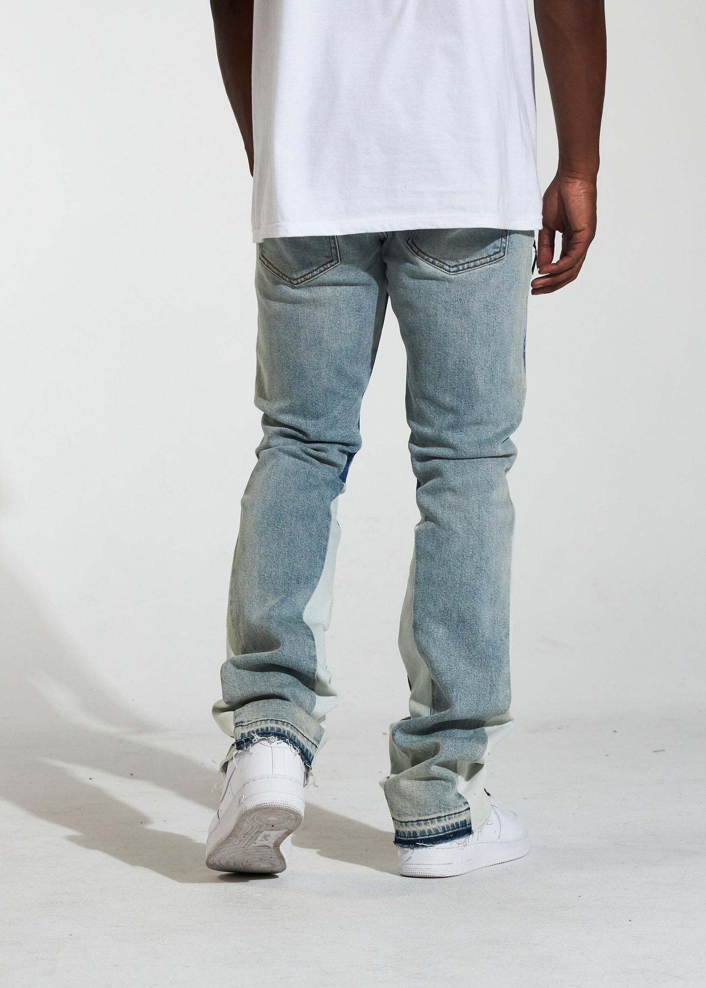 Model wearing Crysp Denim Arch Light Wash Stacked Denim Jeans, side view