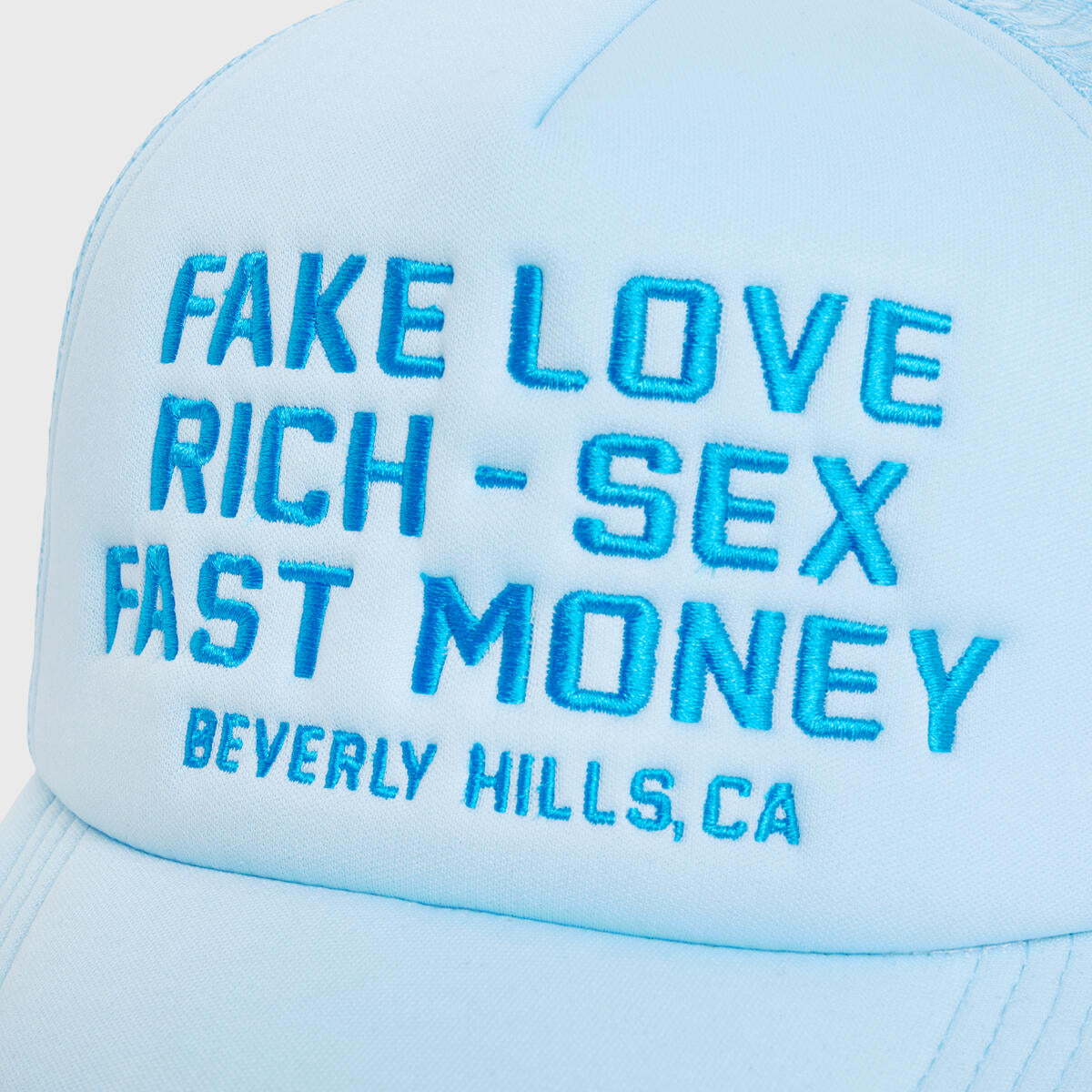 Homme + Femme Fake Love Trucker in baby blue with dark blue and cream logo