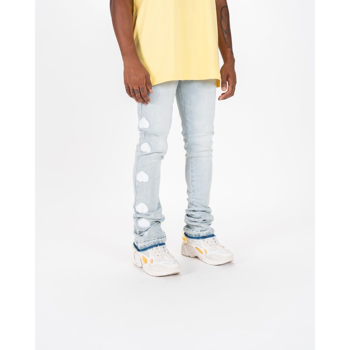 Close-up of PHEELINGS Heartbeat of Success Light Sand Blue Flare Stack Denim, featuring a unique light sand blue flare stack design