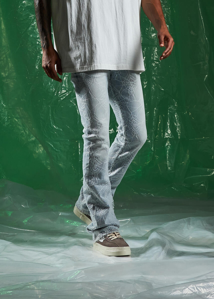 Trendy and eye-catching light blue denim jeans with spider flare style
