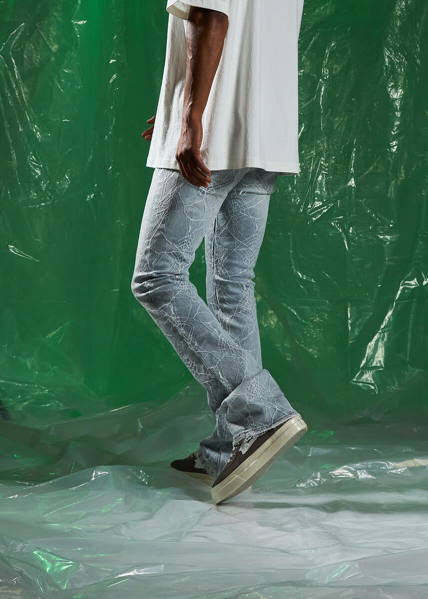 Fashionable light blue denim jeans featuring intricate embellishments