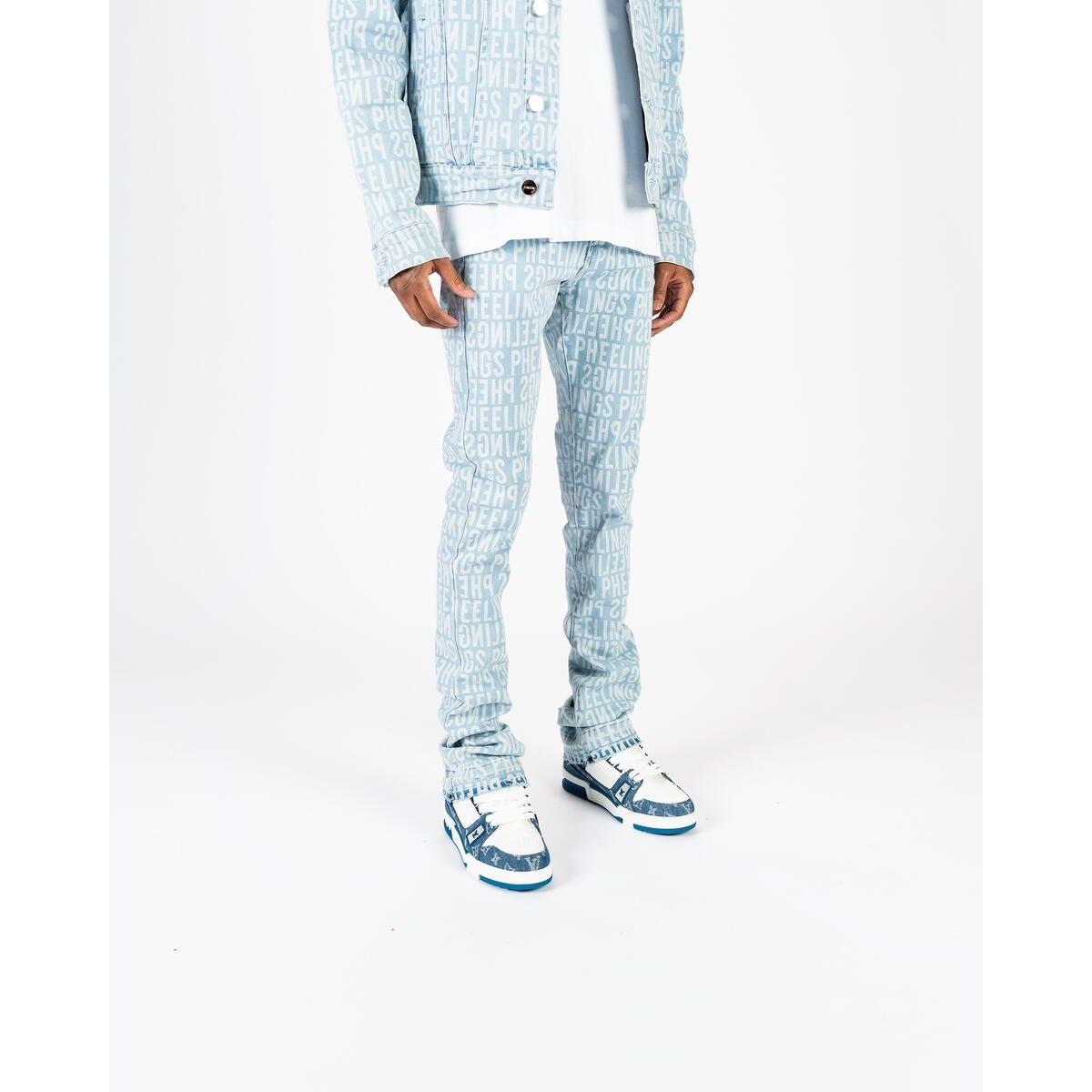 High-rise light blue denim jeans with a distressed finish and flared leg design