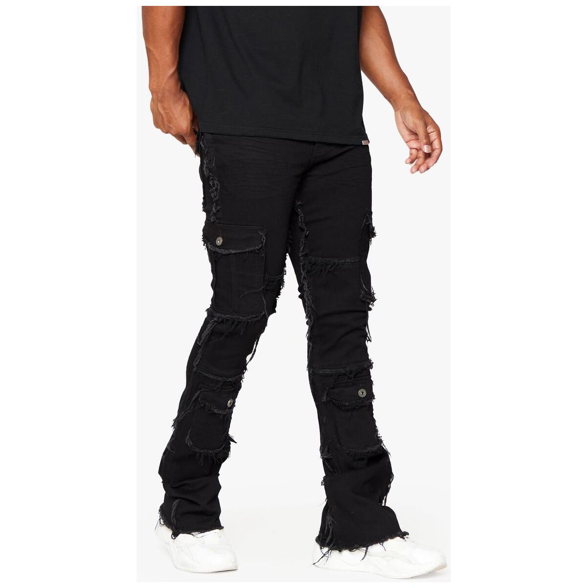 Back view of Valabasas Aegerine Jet Black Stacked Flare Denim featuring a logo patch on the waistband