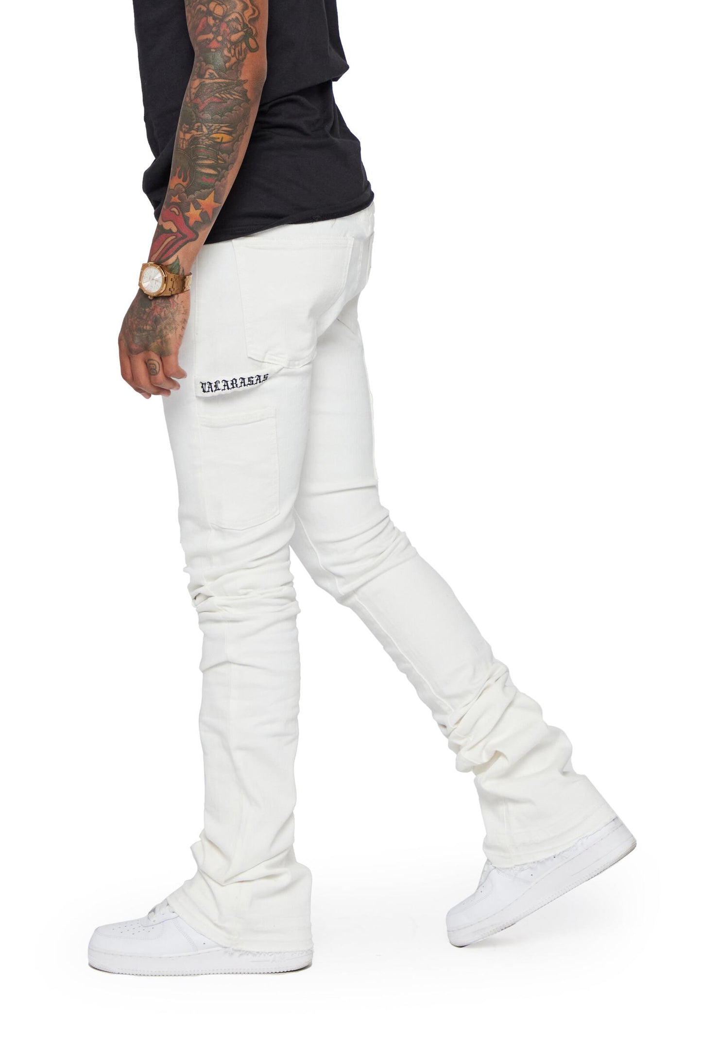 Person wearing the Valabasas Mr Extendo White Super Stacked Flare Denim Jeans in a street style outfit