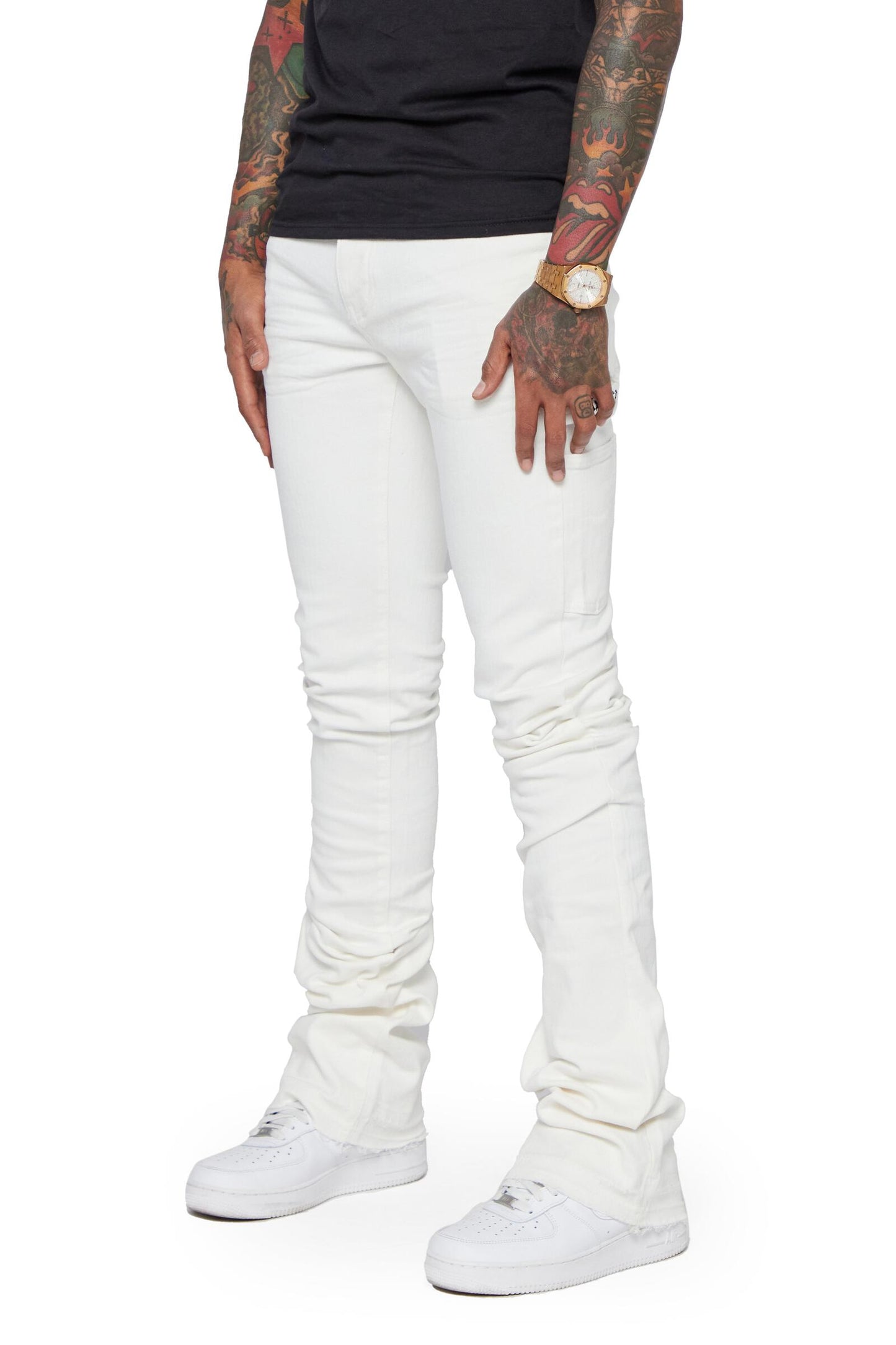 Valabasas Mr Extendo White Super Stacked Flare Denim Jeans paired with a cropped top and boots