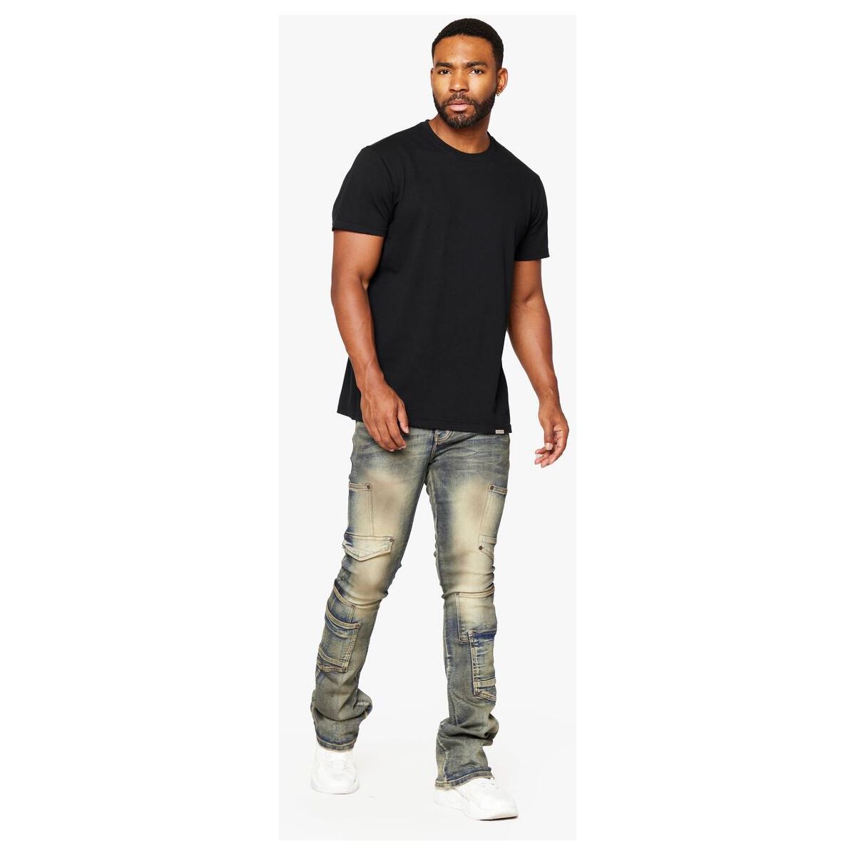 Close-up of the Valabasas Pocros denim's vintage wash and stacked flare design, with a focus on the unique distressed details and stitching