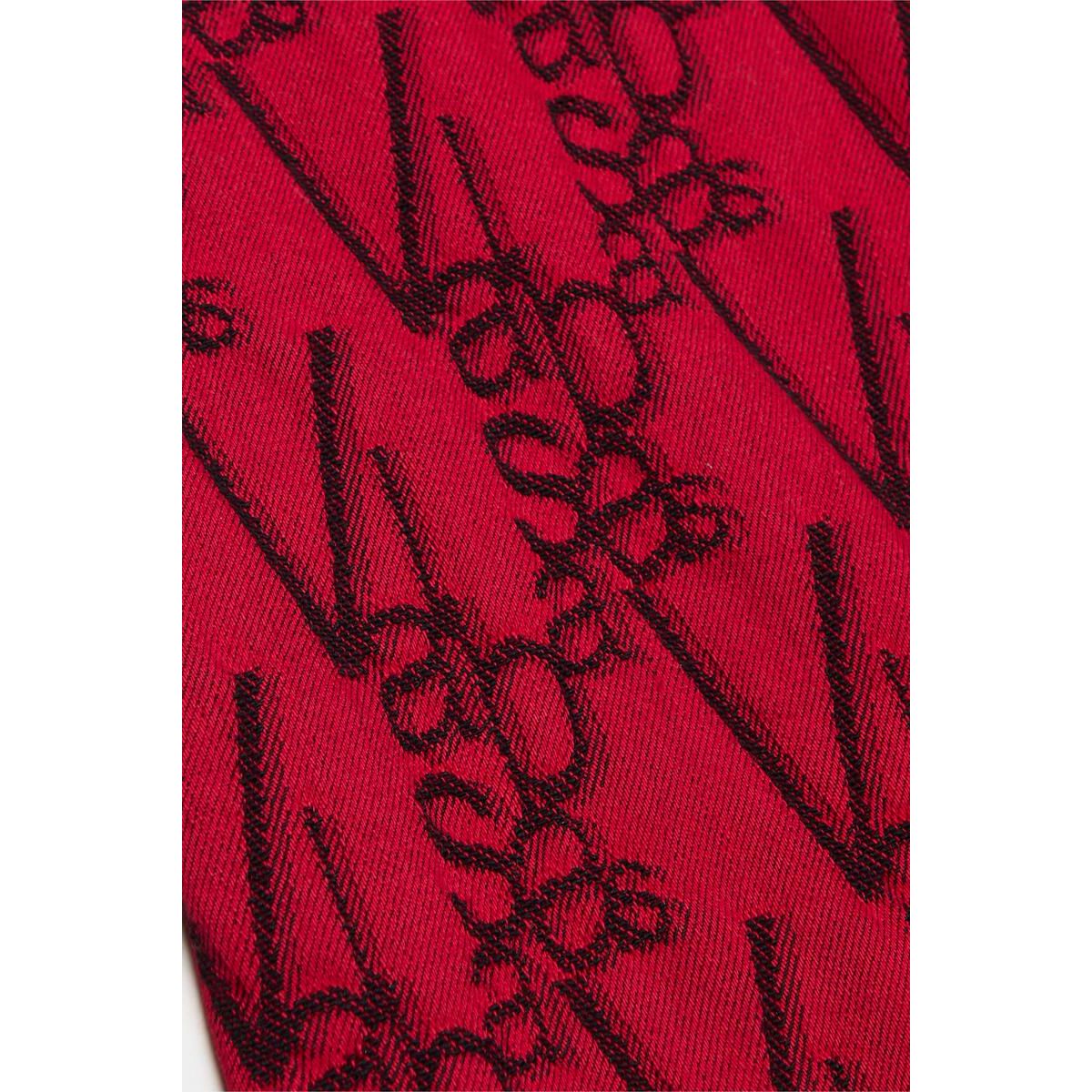 Valabasas V-Scrawl Black Red Stacked Flare Denim Jeans with intricate stitching and a bold color-block design