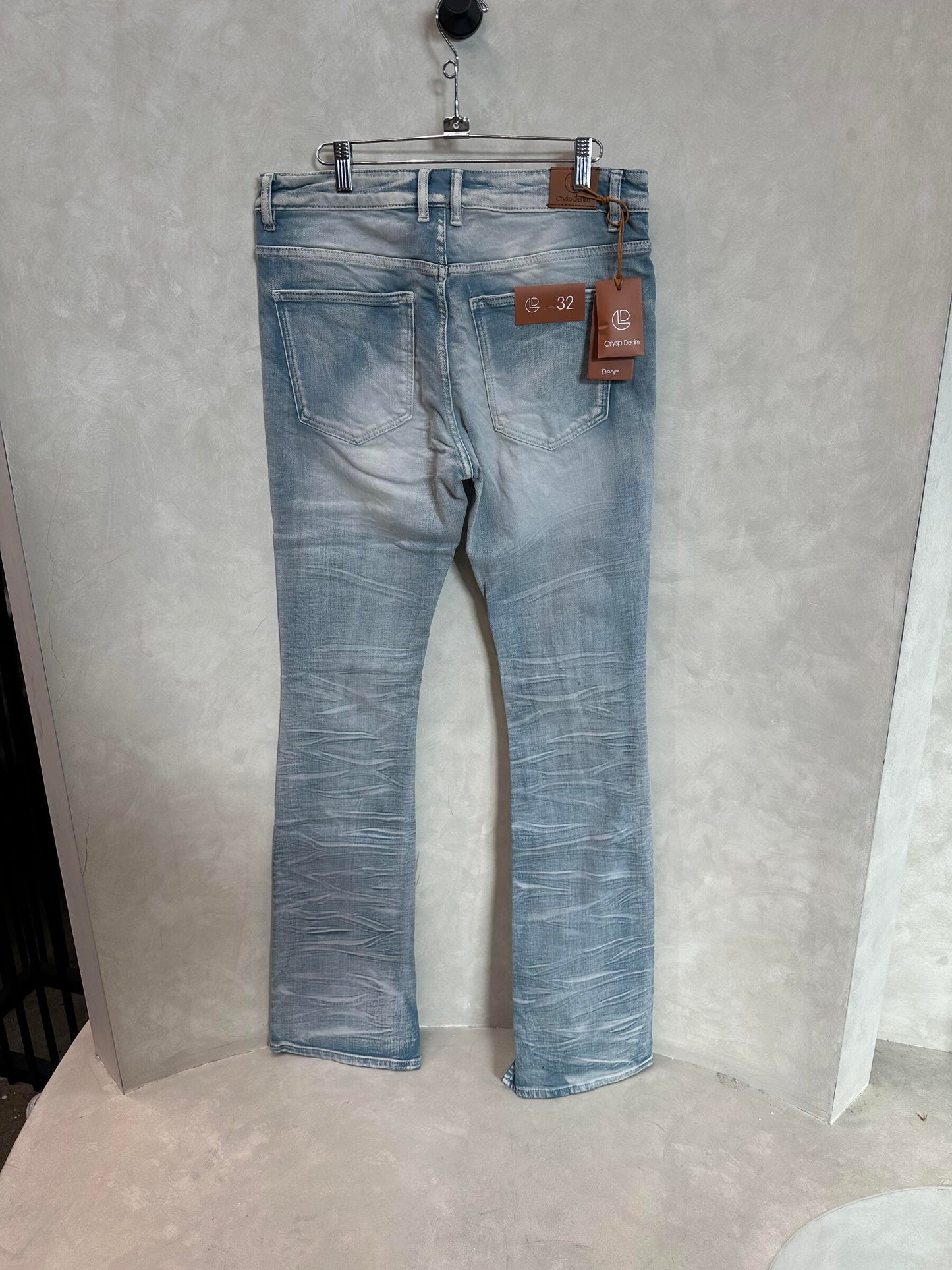 Crysp Denim Arch Marble Wash Stacked Denim Jeans - Side view highlighting distressed details and comfortable stacked fit