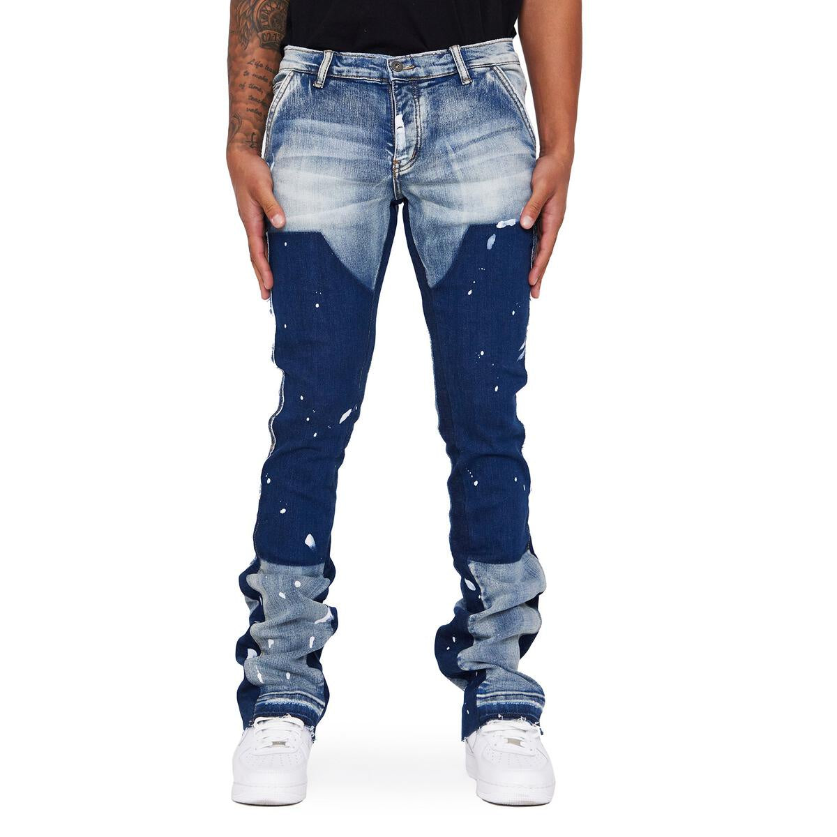 Close-up of Valabasas Alpha Blue Black Stacked Flare Denim Jeans with distressed detailing and frayed hems
