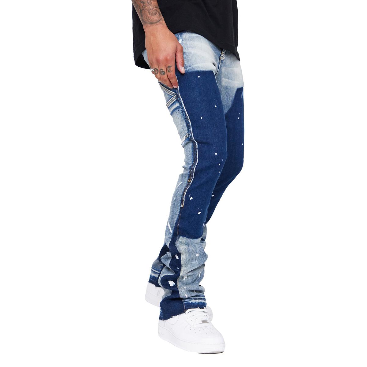 Close-up of Valabasas Alpha Blue Black Stacked Flare Denim Jeans with distressed details and flare leg silhouette