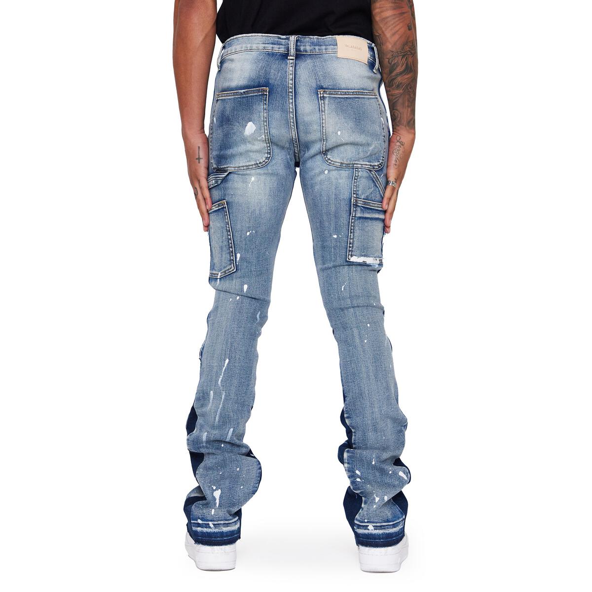 Close-up of Valabasas 'Alpha' Blue Black Stacked Flare Denim Jeans on a hanger