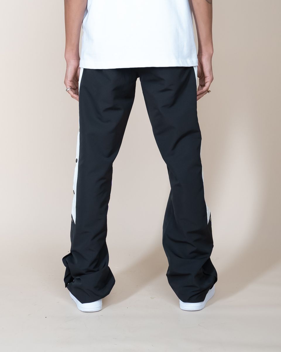 EPTM Goat Flared Pants in Black, side view, on model walking