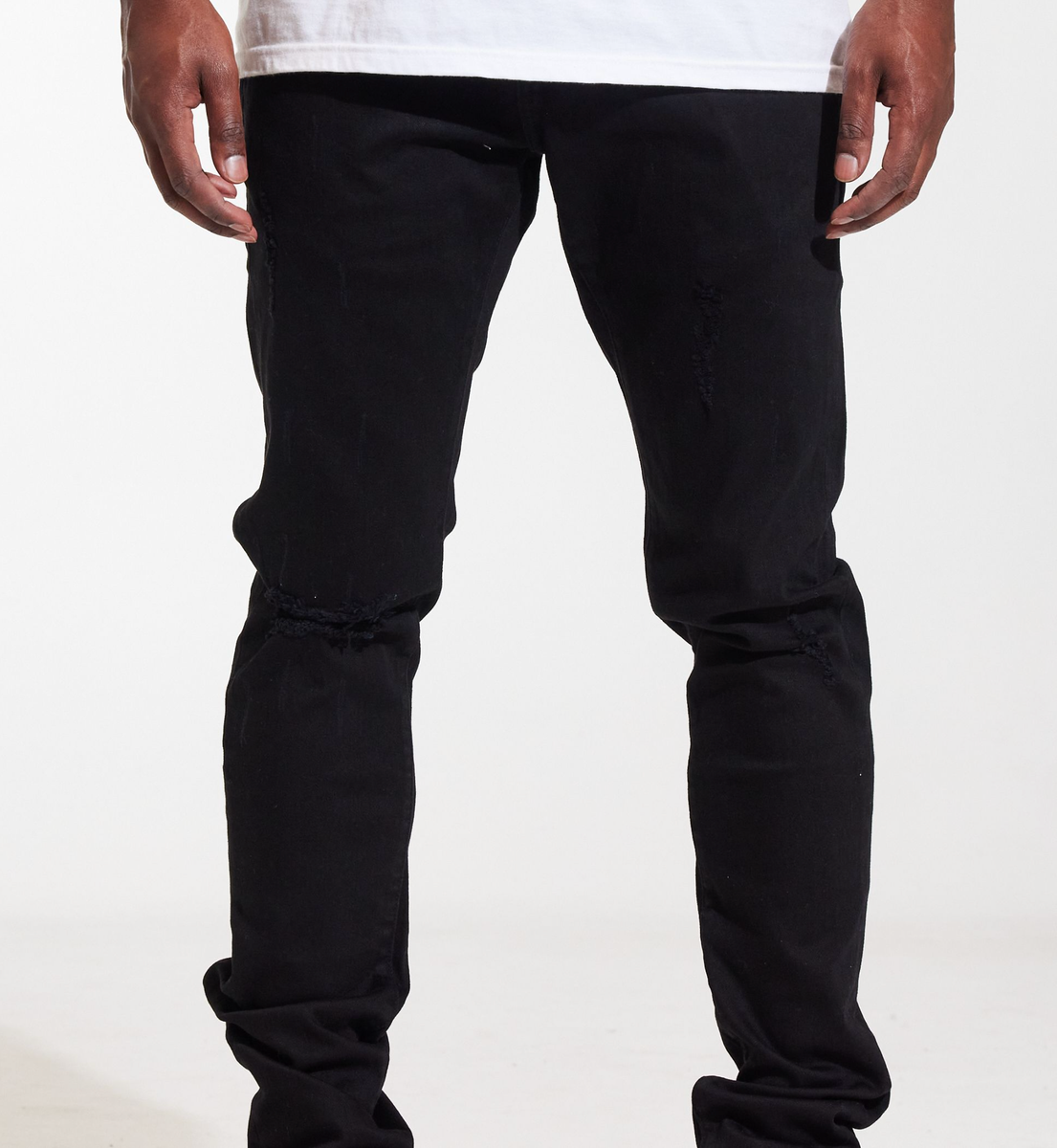 Close-up of the distressed and ripped detailing on the front of the Crysp Denim Atlantic Black Ripped Denim Jeans