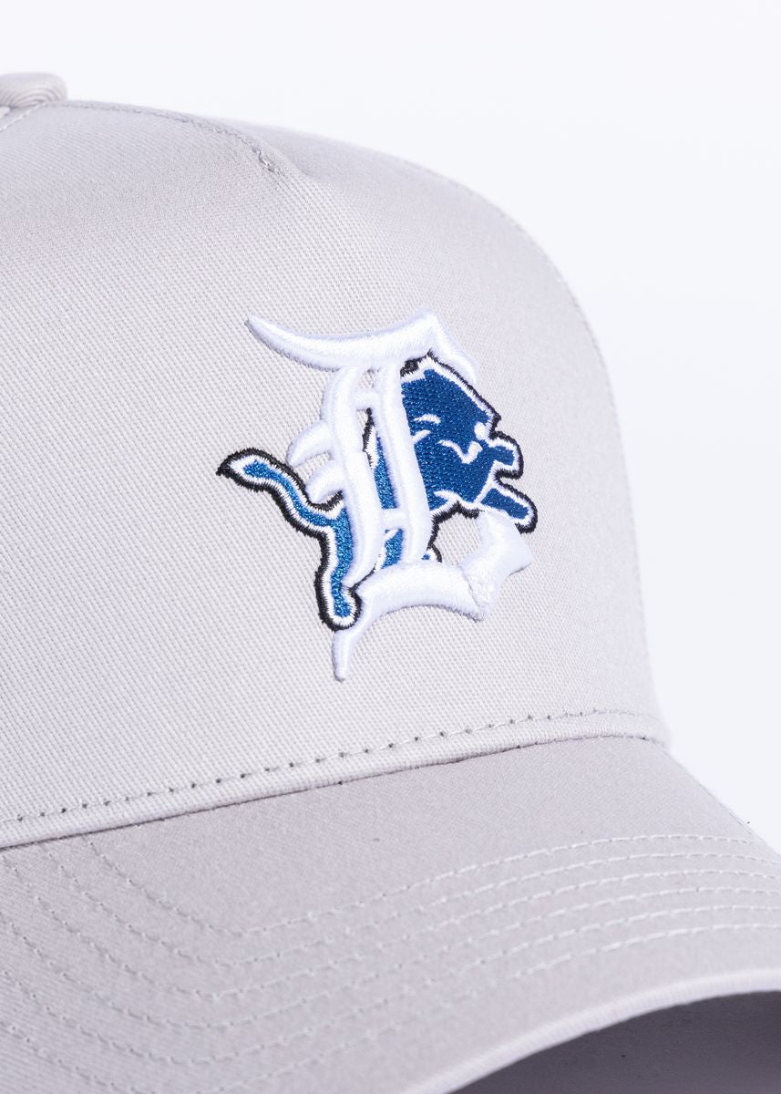 Close-up of silver Ligers snapback hat with embroidered logo and adjustable strap