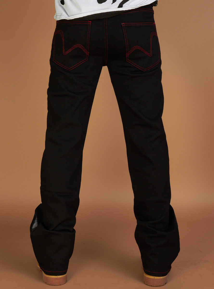 Black denim jeans with red arc patch, perfect for a bold political statement