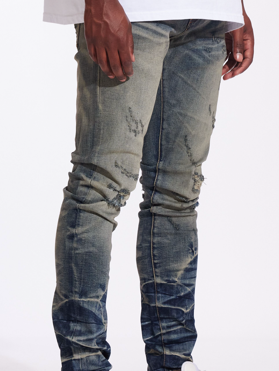 Close-up of the detailing on the Crysp Denim Atlantic Dusty Indigo Denim Jeans (CRYF24-117) showcasing the distressed design and quality stitching