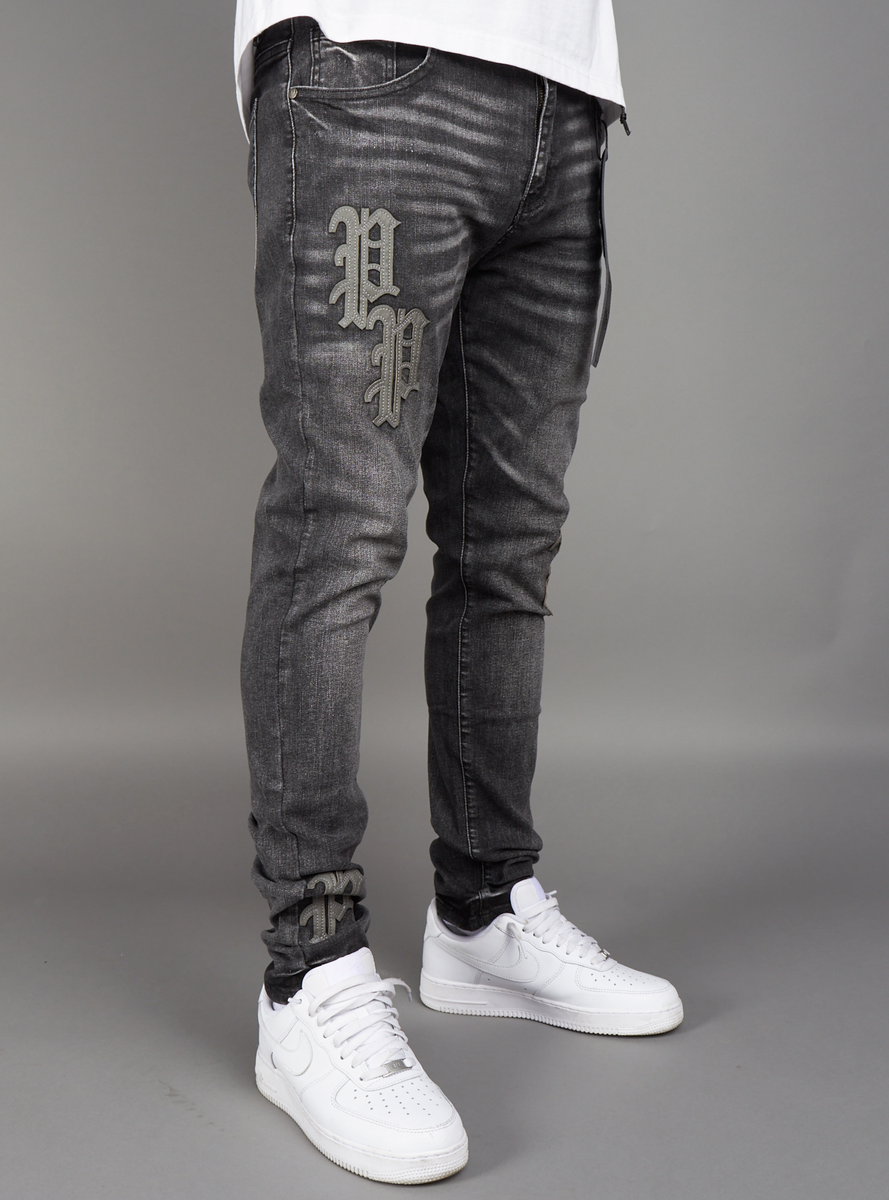 Model wearing Politics Jeans Kael Black Wash Denim (KAEL213) with a stylish and comfortable look