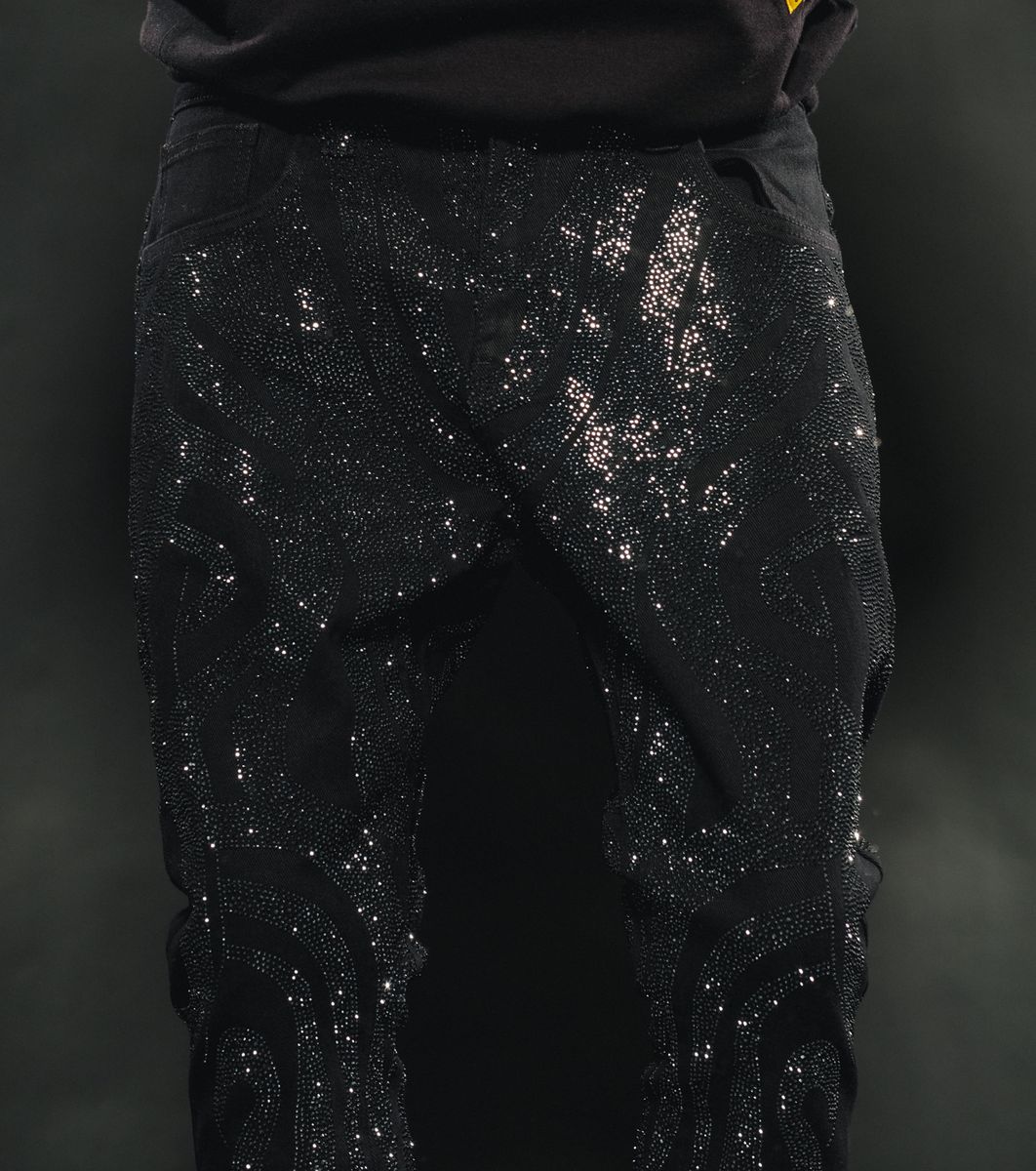 Black denim jeans with rhinestone embellishments for a fierce look